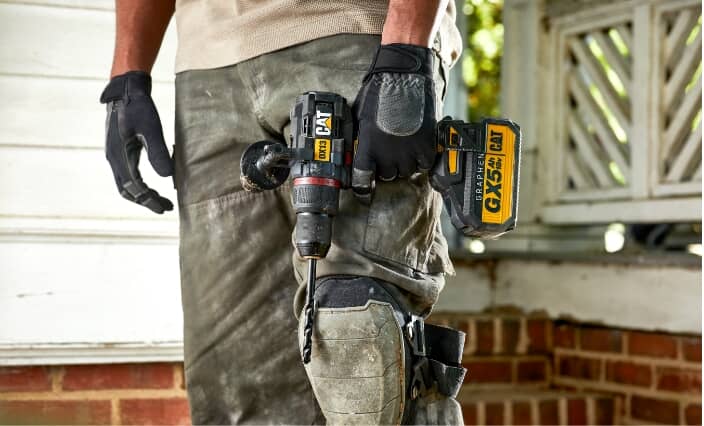 person holding CAT Hammer Drill