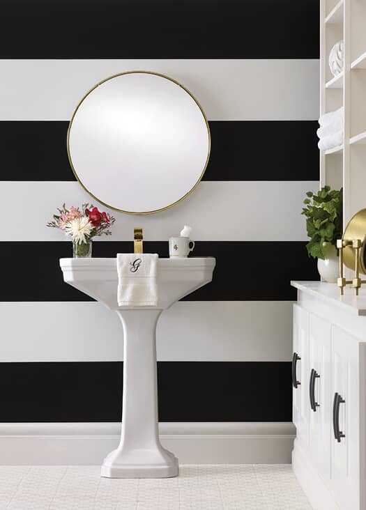 black and white stripe painted bathroom wall