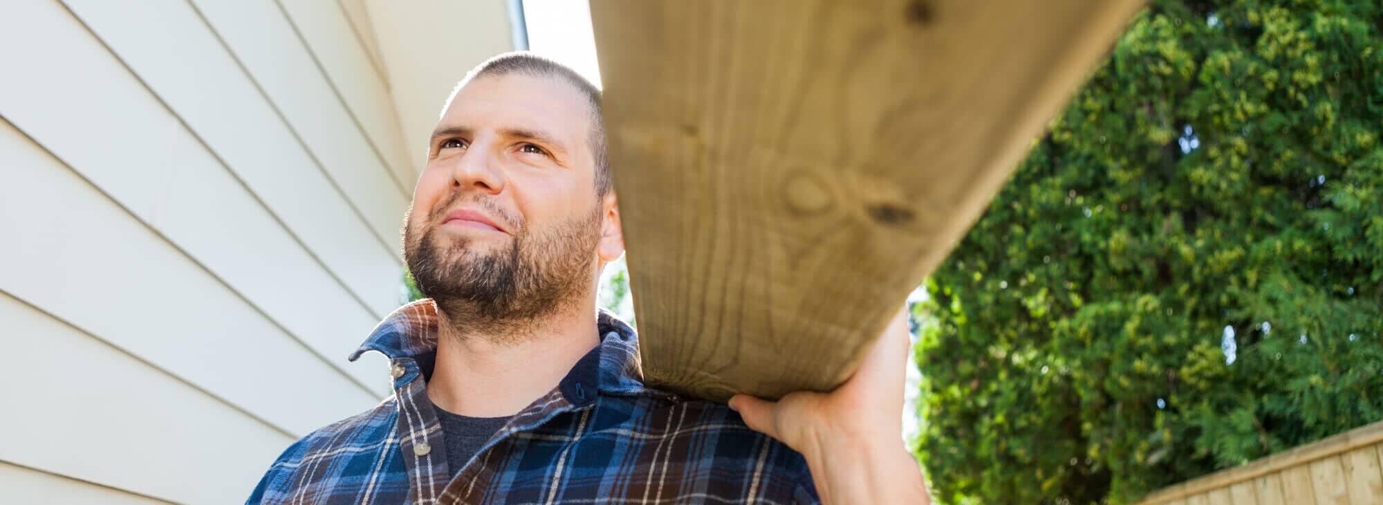 Contractor carrying wood
